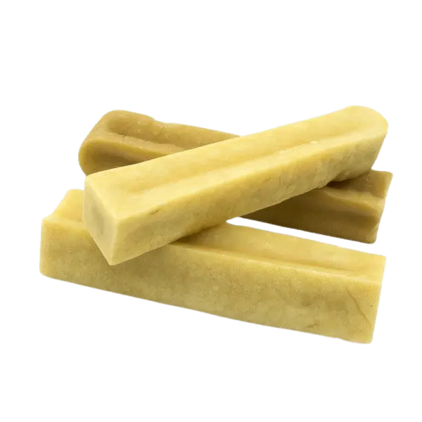 Petello Yak Cheese Dog Chew sticks stacked, showcasing natural texture and handcrafted quality for healthy dog snacking. Ideal for long-lasting chewing.