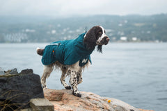 Non-stop Dogwear Fjord lined raincoat leg straps and drainage holes detail